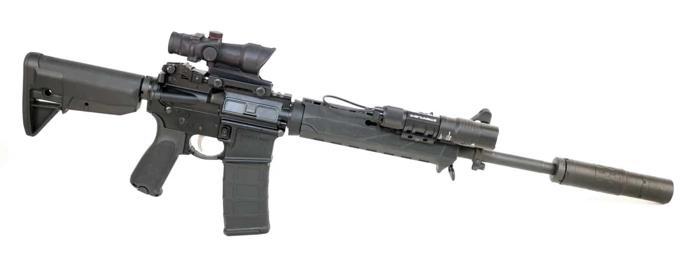 Springfield Armory SAINT equipped with scope tactical flashlight and suppressor