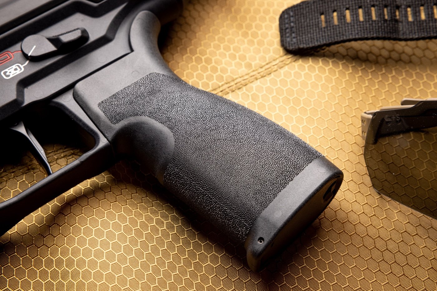Shown is the Springfield Kuna pistol grip. It uses the same great Adaptive Grip Texture that is found on other Springfield Armory pistols like the Echelon and Hellcat. The Adaptive Grip Texture is aggressive without being painful or abrasive. This allows you to better hold onto the gun in all weather conditions and during rapid fire.