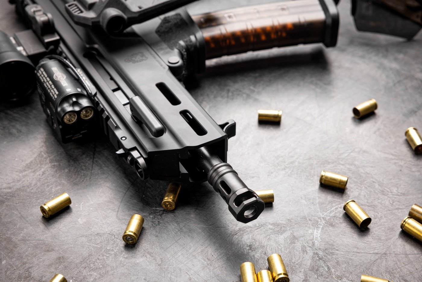 We see spent brass - in other words, empty or used shell cases - laying around the Kuna. The author shot the Kuna a lot to test the gun's reliability. With hollow point bullets and full metal jacket bullets, the gun was reliable and accurate. It had no malfunctions.