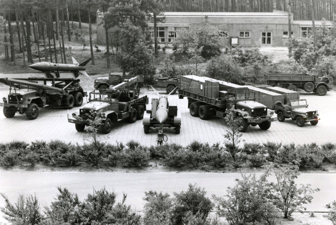 Honest John unit with M386 truck rocket launcher M62 5-ton wrecker M329 rocket transport trailer M78A1