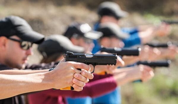 gun range concealed carry Young people on tactical gun training classes. Shooting and Weapons iStock-guruXOOX 1305500703